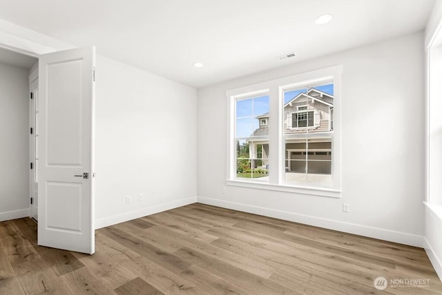 19512 81st Pl NE Unit 4, Kenmore, WA 98028 - empty room with wood finished floors and recessed lighting