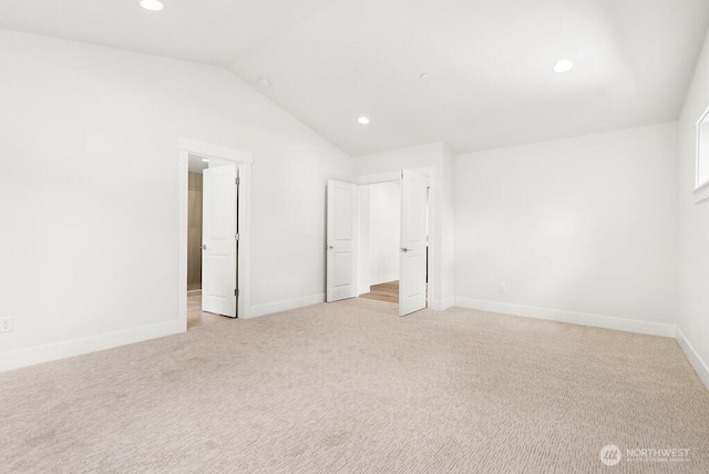 19512 81st Pl NE Unit 4, Kenmore, WA 98028 - unfurnished bedroom featuring light carpet, lofted ceiling, and recessed lighting