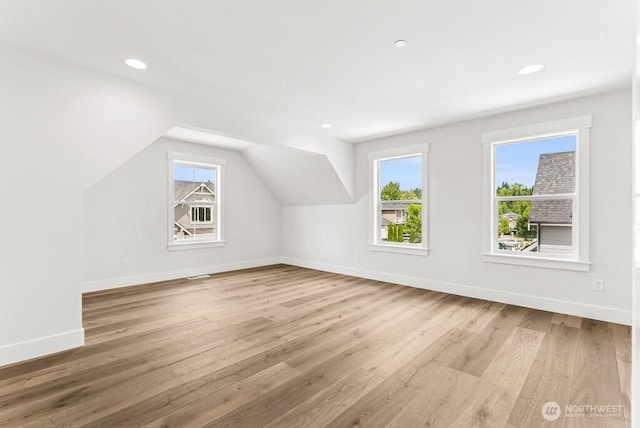 19512 81st Pl NE Unit 4, Kenmore, WA 98028 - additional living space with healthy amount of natural light, wood finished floors, vaulted ceiling, and recessed lighting