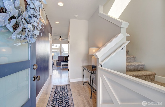 foyer entrance with baseboards, ceiling fan, stairway, recessed lighting, and light wood-style flooring