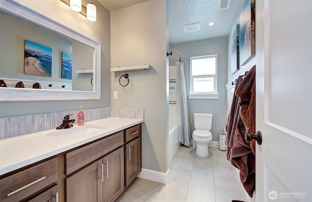 bathroom featuring visible vents, tile patterned flooring, toilet, and vanity