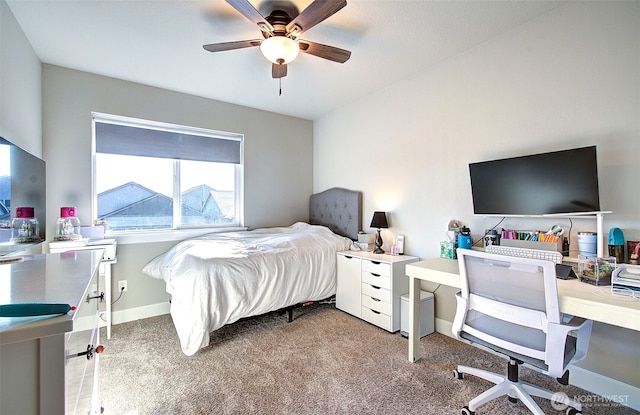 carpeted bedroom featuring a ceiling fan and baseboards