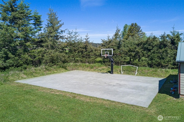 142 Pemberton Pl, Friday Harbor, WA 98250 - view of basketball court with basketball hoop and a lawn