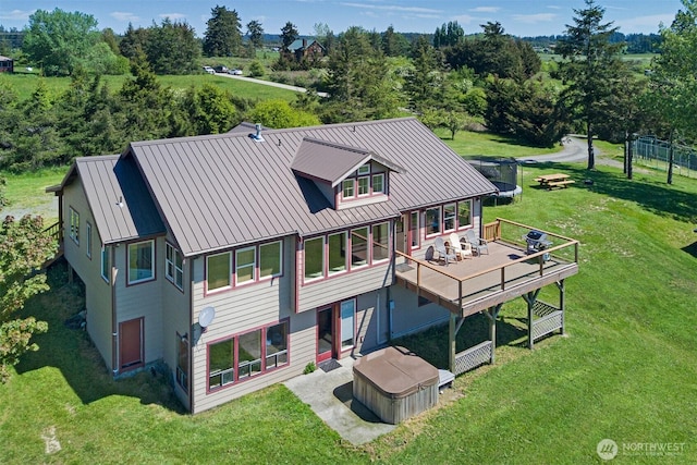 142 Pemberton Pl, Friday Harbor, WA 98250 - back of property with a lawn, a deck, metal roof, and a patio area