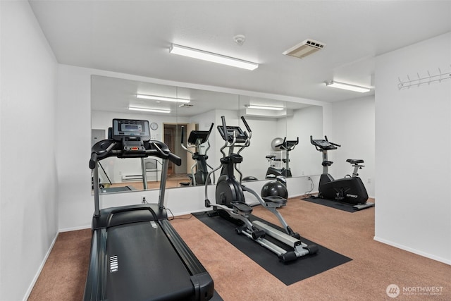 gym with carpet flooring, visible vents, and baseboards