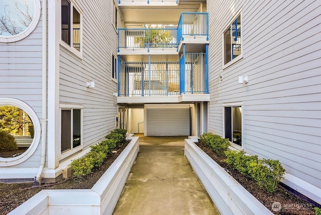 exterior space featuring an attached garage and concrete driveway