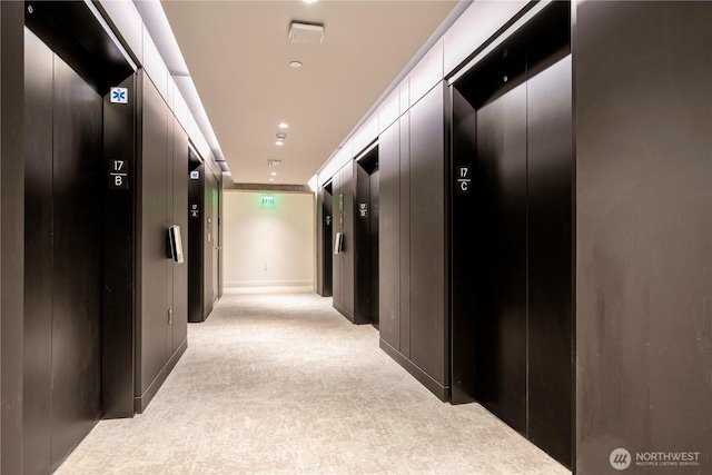 300 Virginia St Unit 1710, Seattle, WA 98101 - hallway with elevator and light carpet