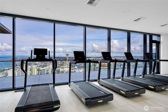 300 Virginia St Unit 1710, Seattle, WA 98101 - gym featuring wood finished floors, floor to ceiling windows, and visible vents
