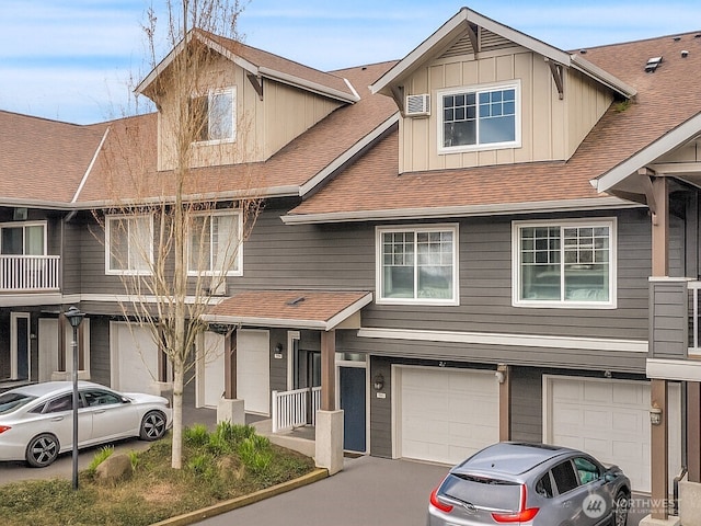 10800 SE 17th Cir Unit H101, Vancouver, WA 98664 - townhome / multi-family property with an attached garage, a shingled roof, and board and batten siding
