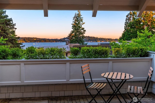 balcony featuring a water view
