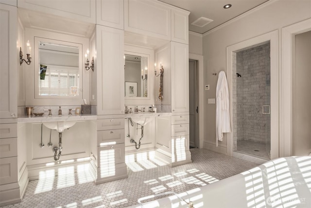 full bath featuring vanity, a stall shower, ornamental molding, and visible vents