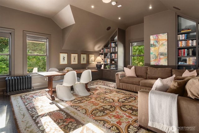 home office featuring built in shelves, radiator, vaulted ceiling, and recessed lighting
