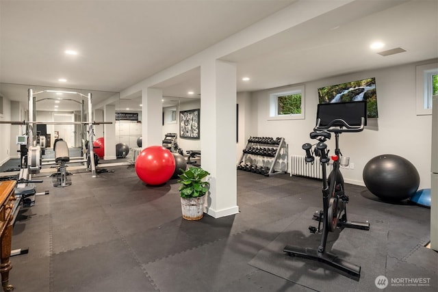 workout area with radiator heating unit, baseboards, and recessed lighting