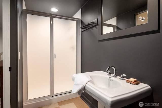 bathroom with tile patterned floors and a stall shower
