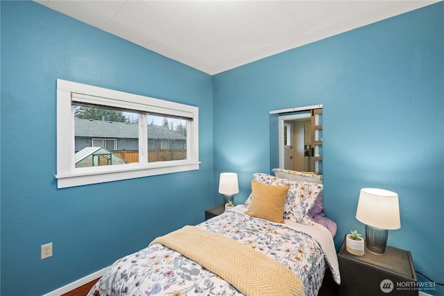 bedroom featuring baseboards