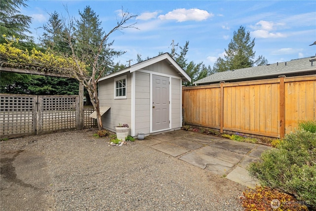 view of shed featuring a fenced backyard