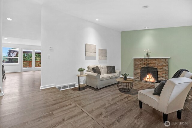 11819 Nevers Rd, Snohomish, WA 98290 - living room with recessed lighting, a fireplace, visible vents, and wood finished floors