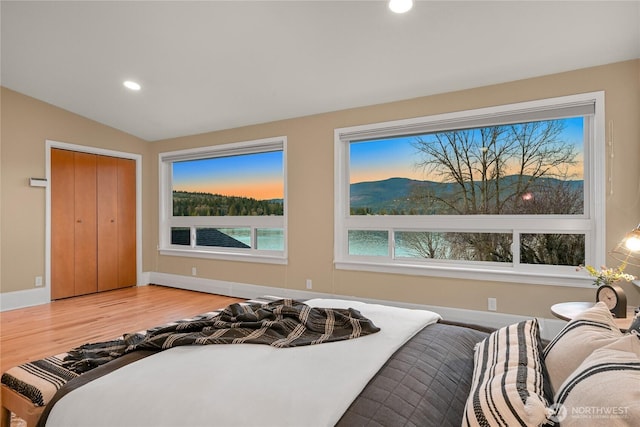 1016 Coronado Ave, Bellingham, WA 98229 - bedroom featuring recessed lighting, wood finished floors, a closet, vaulted ceiling, and baseboards