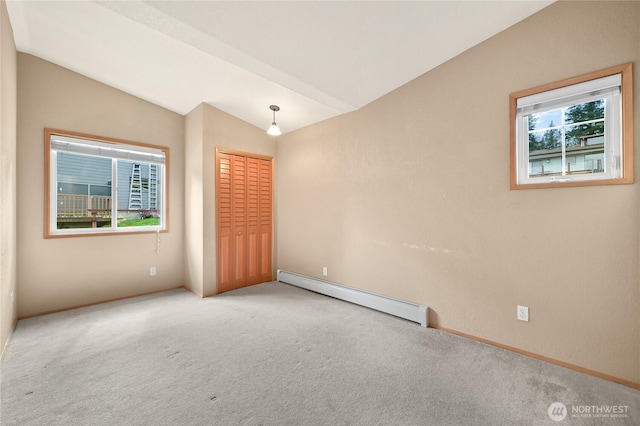 1016 Coronado Ave, Bellingham, WA 98229 - carpeted empty room with a healthy amount of sunlight, baseboards, a baseboard heating unit, and lofted ceiling