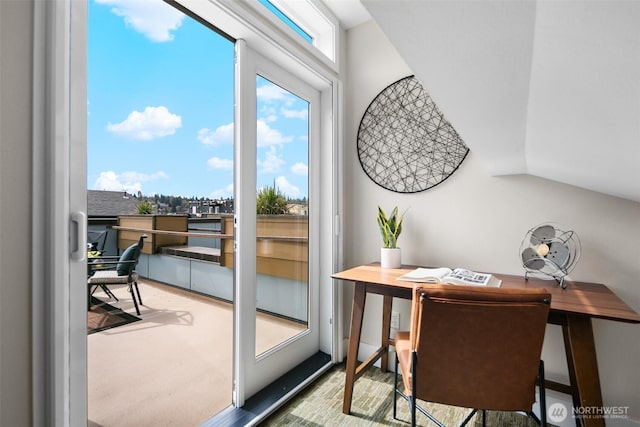 doorway featuring lofted ceiling