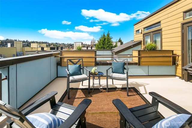 view of patio featuring a balcony