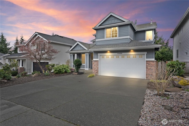 view of front of house with a garage, brick siding, driveway, and a shingled roof