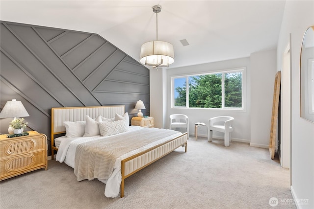 bedroom with visible vents, light colored carpet, baseboards, and lofted ceiling