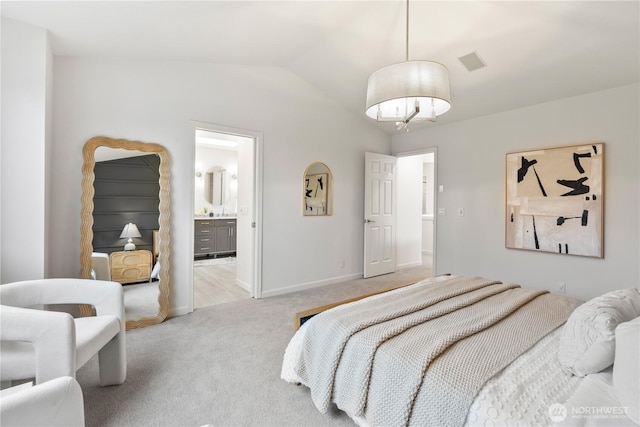 bedroom featuring carpet, baseboards, connected bathroom, and lofted ceiling