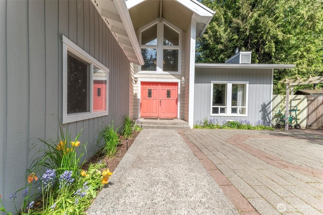 doorway to property with a chimney