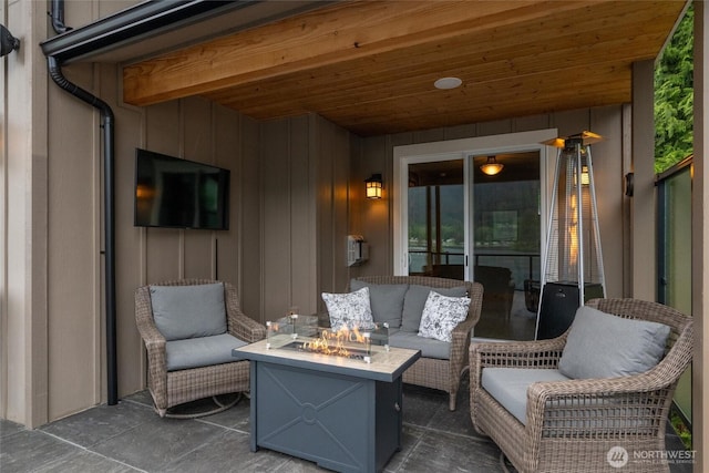 view of patio / terrace with an outdoor living space with a fire pit