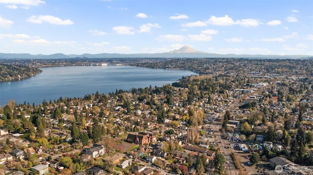 aerial view featuring a water and mountain view