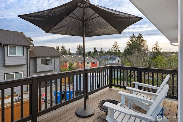 wooden deck featuring a residential view