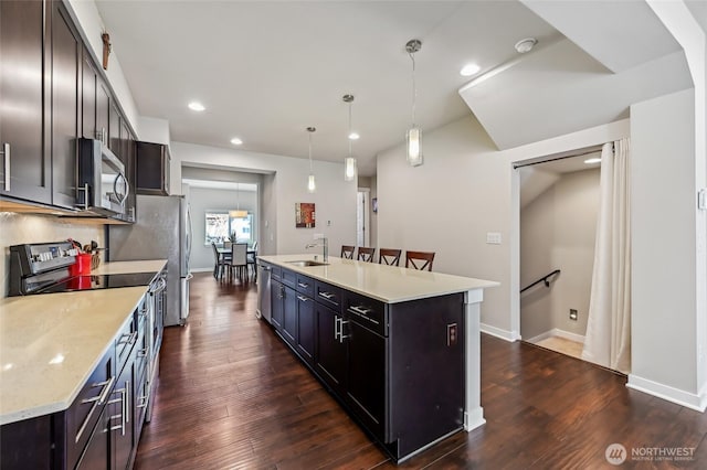 19225 Damson Rd Unit J2, Lynnwood, WA 98036 - kitchen featuring a sink, appliances with stainless steel finishes, a center island with sink, and dark wood-style floors
