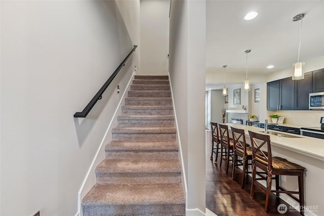 19225 Damson Rd Unit J2, Lynnwood, WA 98036 - staircase with wood finished floors, baseboards, and recessed lighting
