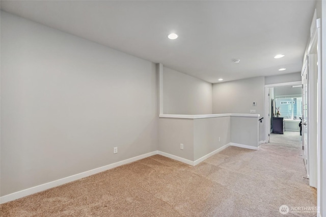 19225 Damson Rd Unit J2, Lynnwood, WA 98036 - unfurnished room featuring light colored carpet, baseboards, and recessed lighting