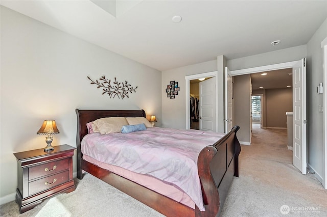 19225 Damson Rd Unit J2, Lynnwood, WA 98036 - bedroom featuring a closet, a spacious closet, light carpet, and baseboards