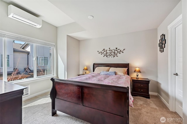 19225 Damson Rd Unit J2, Lynnwood, WA 98036 - bedroom with baseboards, a wall mounted AC, and light carpet