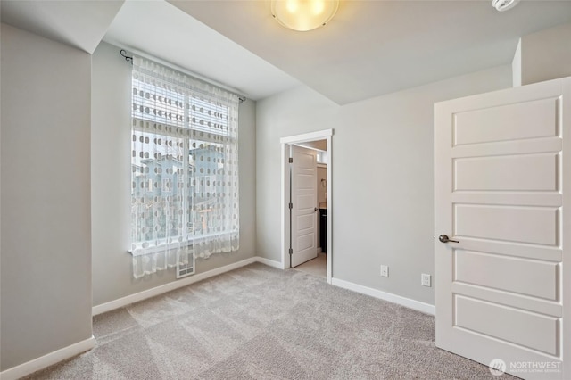 19225 Damson Rd Unit J2, Lynnwood, WA 98036 - unfurnished bedroom featuring carpet flooring and baseboards