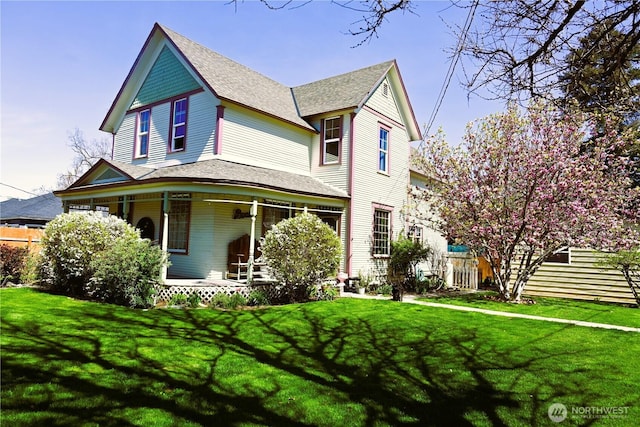 1321 Chestnut St, Milton-Freewater, OR 97862 - victorian house featuring covered porch, a front yard, and a shingled roof