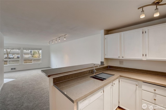 24762 45th Ave S Unit 12-D1, Kent, WA 98032 - kitchen featuring a sink, dishwasher, a peninsula, white cabinets, and open floor plan