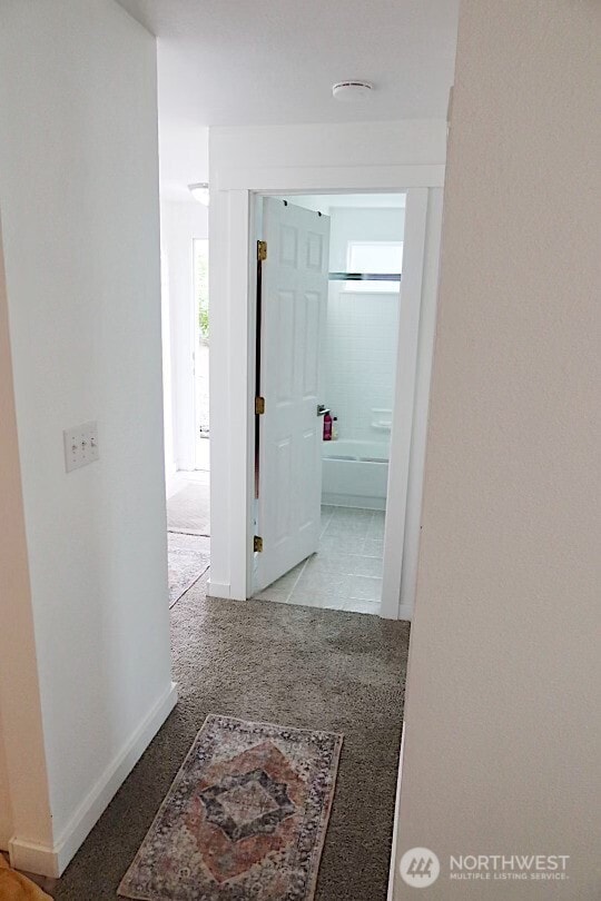 24762 45th Ave S Unit 12-D1, Kent, WA 98032 - hallway with baseboards