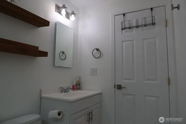 24762 45th Ave S Unit 12-D1, Kent, WA 98032 - half bathroom featuring vanity and toilet
