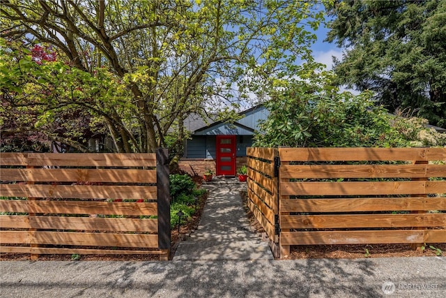 view of gate with fence