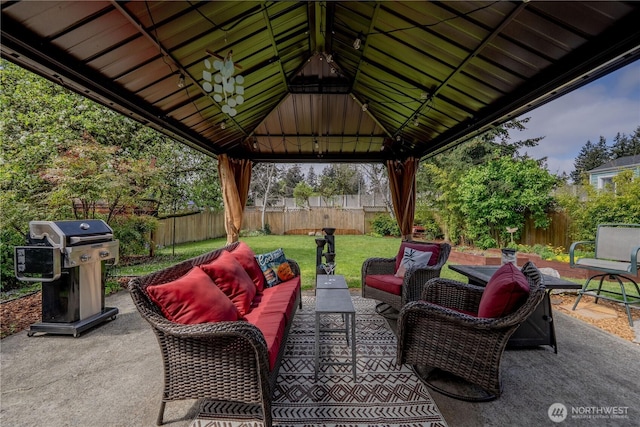 view of patio / terrace with a fenced backyard, a gazebo, an outdoor living space, and area for grilling