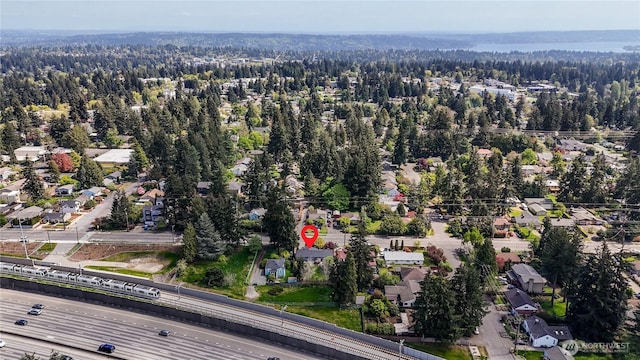 drone / aerial view featuring a view of trees