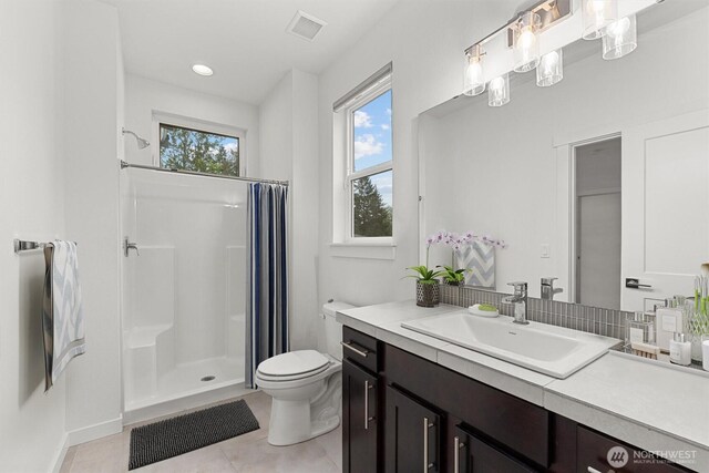 7872 198th Avenue Pl E, Bonney Lake, WA 98391 - full bath with toilet, a shower stall, tile patterned flooring, vanity, and recessed lighting