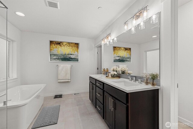 7872 198th Avenue Pl E, Bonney Lake, WA 98391 - full bathroom featuring double vanity, a soaking tub, baseboards, tile patterned floors, and recessed lighting