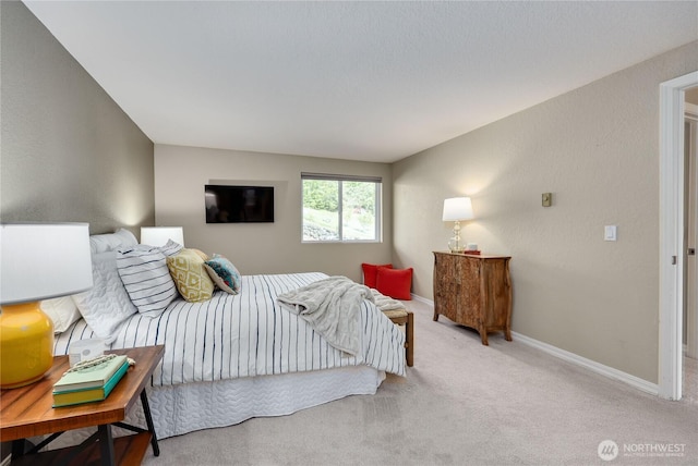carpeted bedroom with baseboards