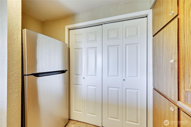 interior space with freestanding refrigerator