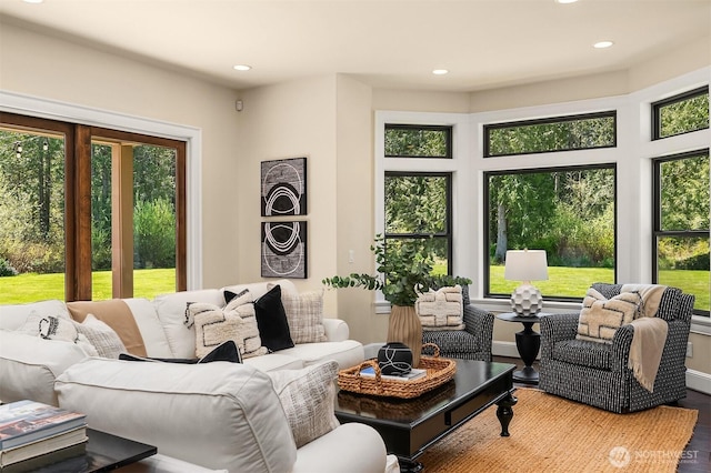 living room with wood finished floors and recessed lighting